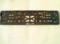 Рамка номера пластик с защелкой, черная, рельеф, AUDI серебро (уп.30 шт.)